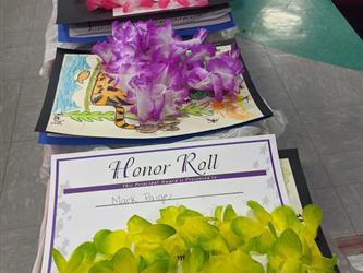 leis on top of certificates