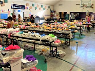 more tables filled with  bags